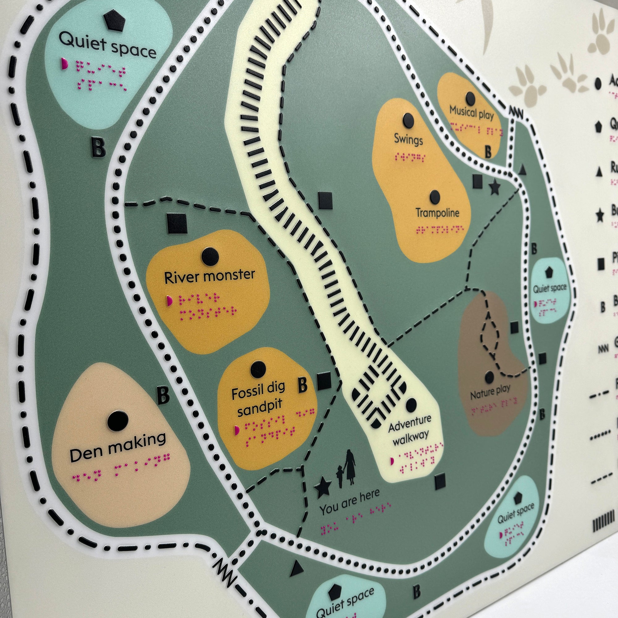 Labelled braille tactile map of childrens outdoor play area.