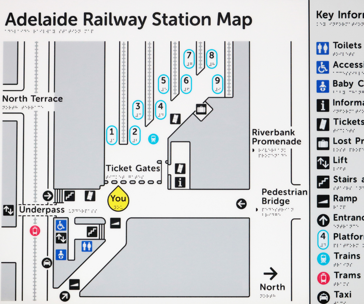 Braille tactile map of Adelaide Railway Station with key information icons on the right.