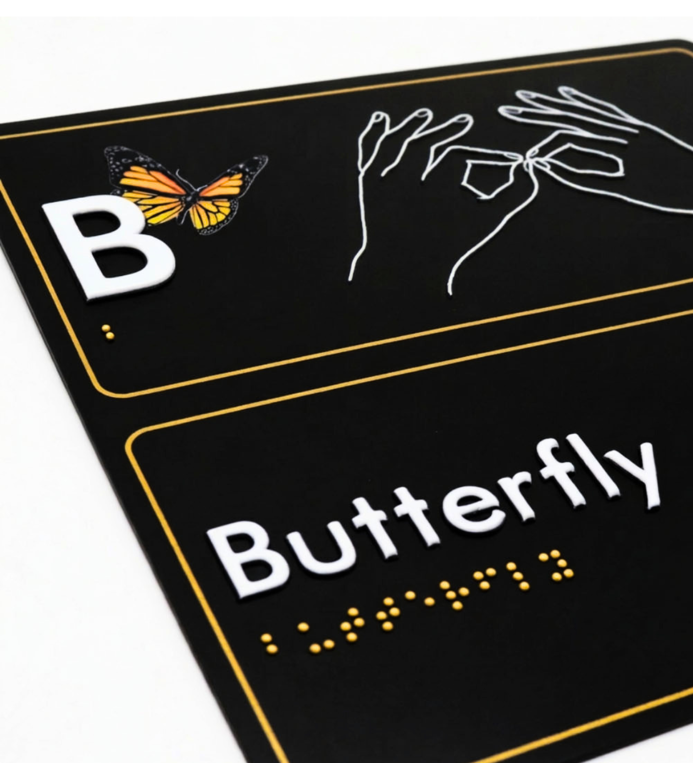 AUSLAN sign for letter 'B' with a butterfly illustration, hand, and braille text on a black background.