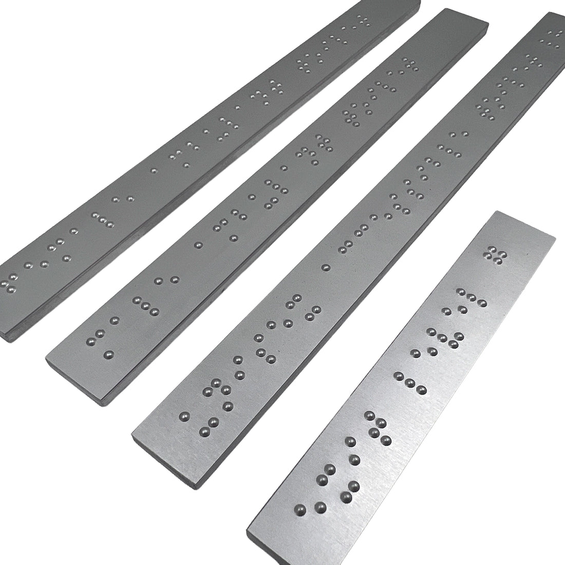 Close up of silver braille strips.