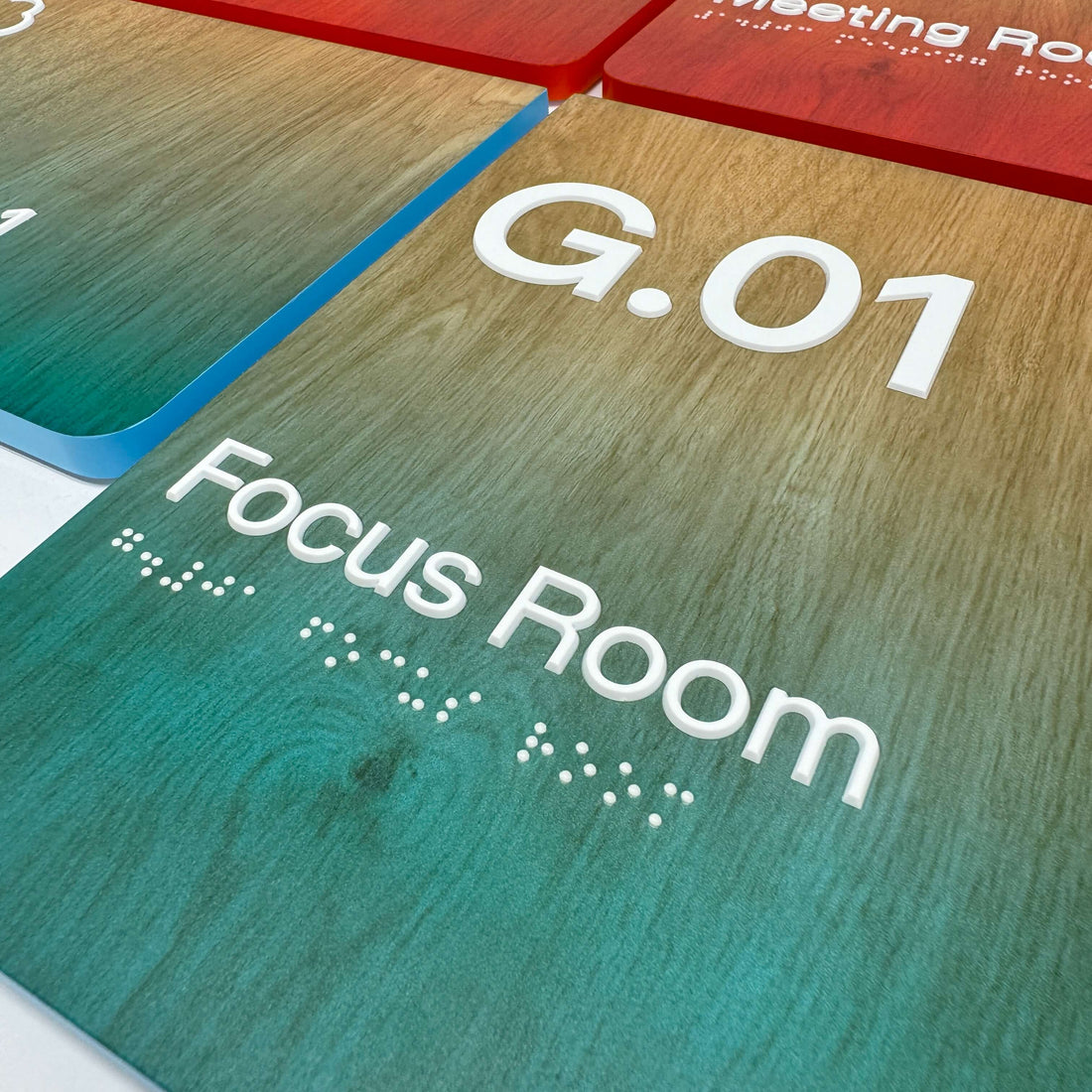 Multicoloured wooden braille tactile sign for Focus Room.