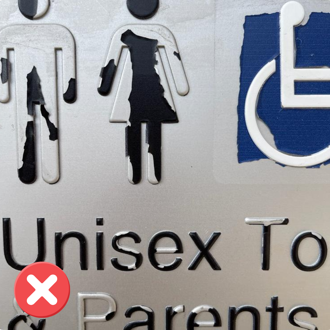 Photo of non-compliant braille signage - colour peeling off, making the text and icon illegible in parts.